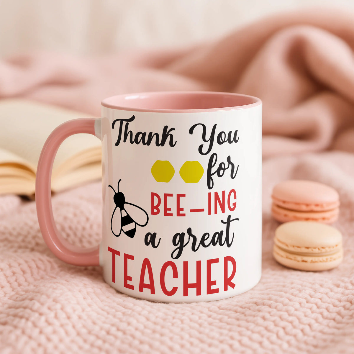 Mug with 'Thank you for bee-ing a great teacher' text on a pink background